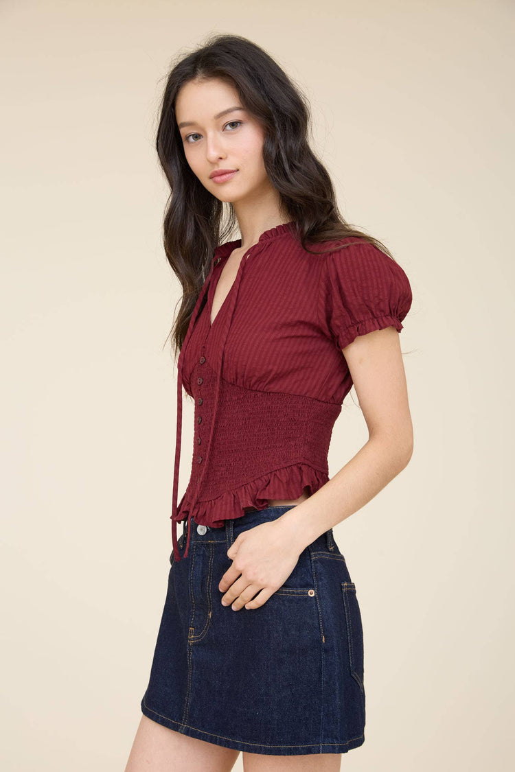 SMOCKED PEPLUM TIE NECK RUFFLED TOP