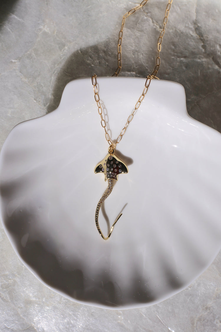 Hihimanu Spotted Eagle Ray Gold Charm Necklace on a Shell Plate