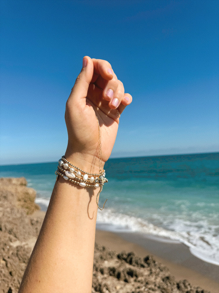 Hihimanu Spotted Eagle Ray Gold Charm Necklace Wrapped on Hand
