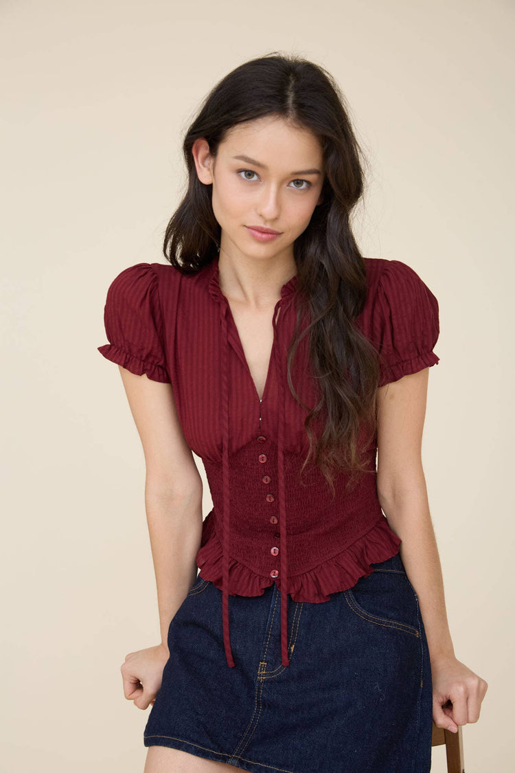 SMOCKED PEPLUM TIE NECK RUFFLED TOP