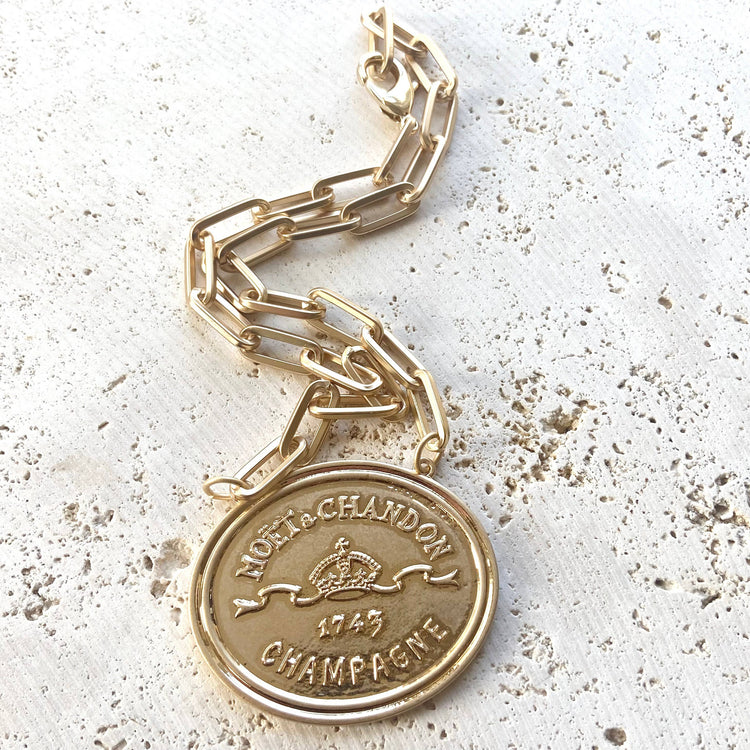 French coin, champagne label statement necklace, gold