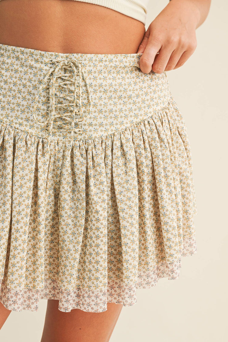 FLORAL MINI SKIRT WITH A LACE-UP DETAIL AT THE FRONT