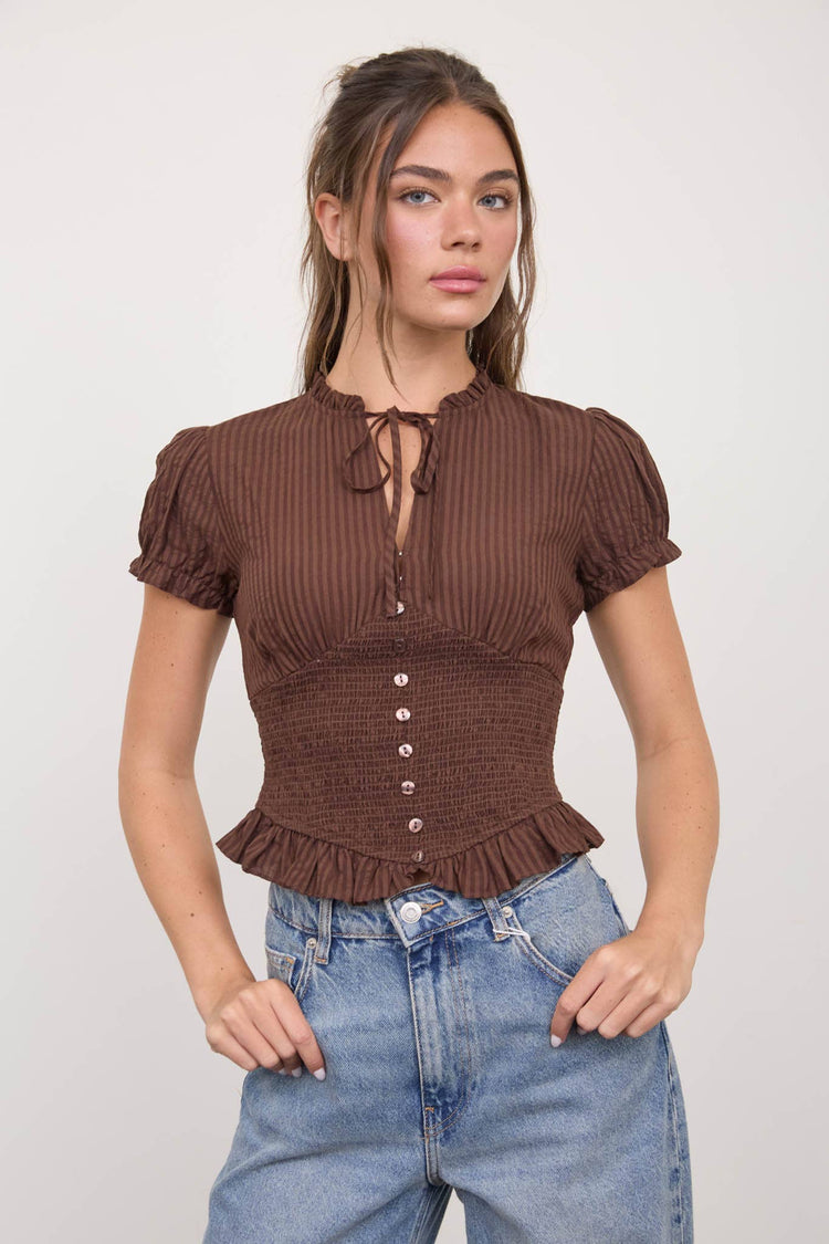 SMOCKED PEPLUM TIE NECK RUFFLED TOP