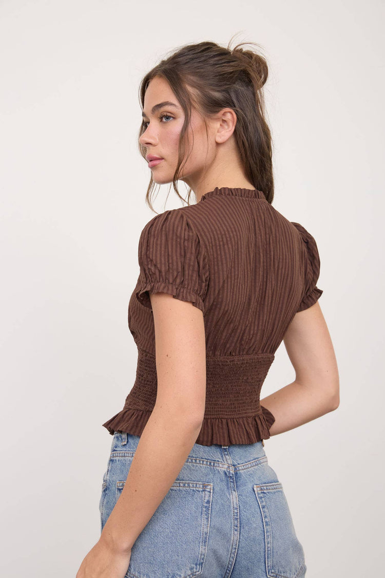 SMOCKED PEPLUM TIE NECK RUFFLED TOP