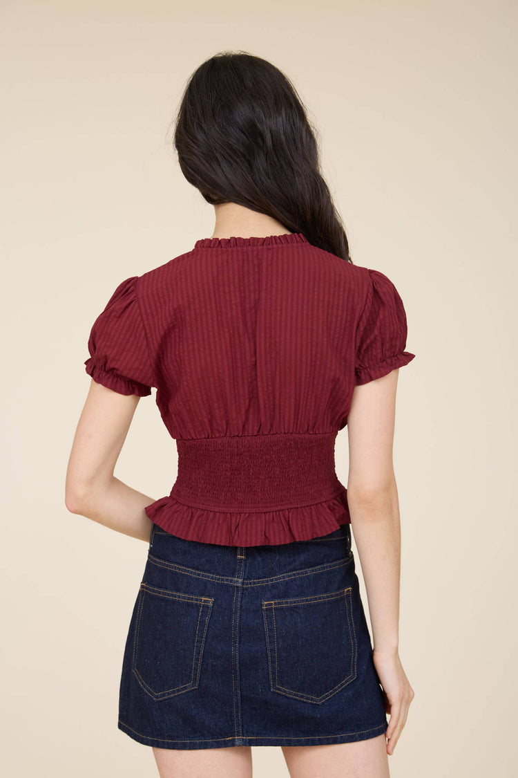SMOCKED PEPLUM TIE NECK RUFFLED TOP