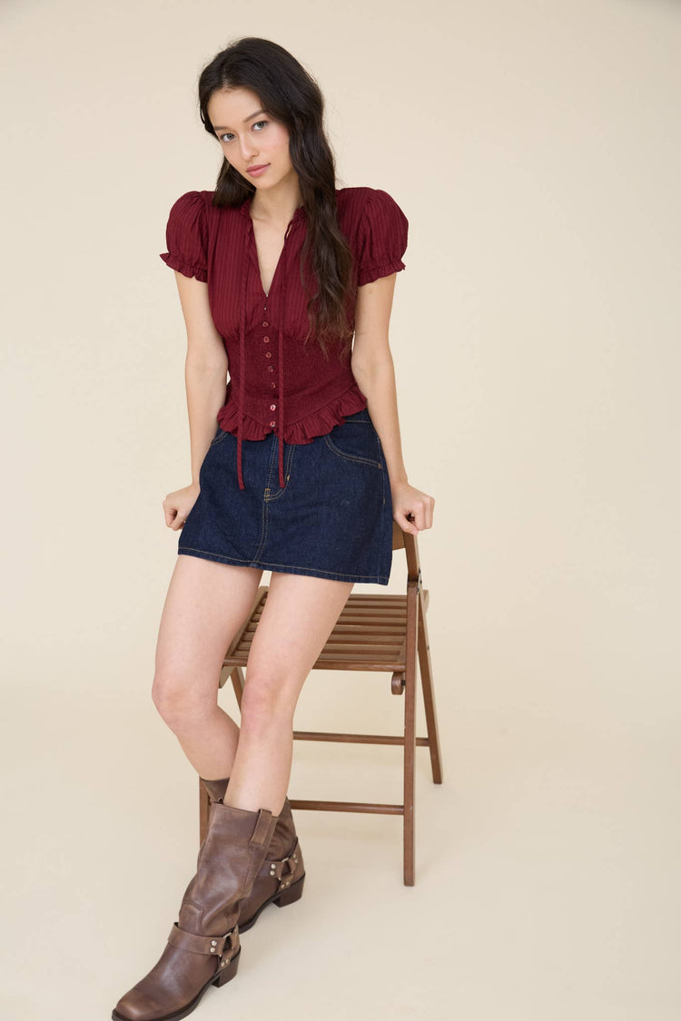 SMOCKED PEPLUM TIE NECK RUFFLED TOP
