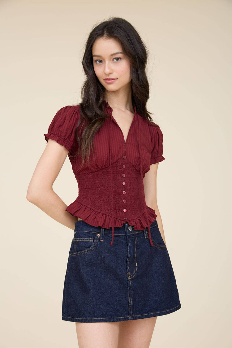 SMOCKED PEPLUM TIE NECK RUFFLED TOP