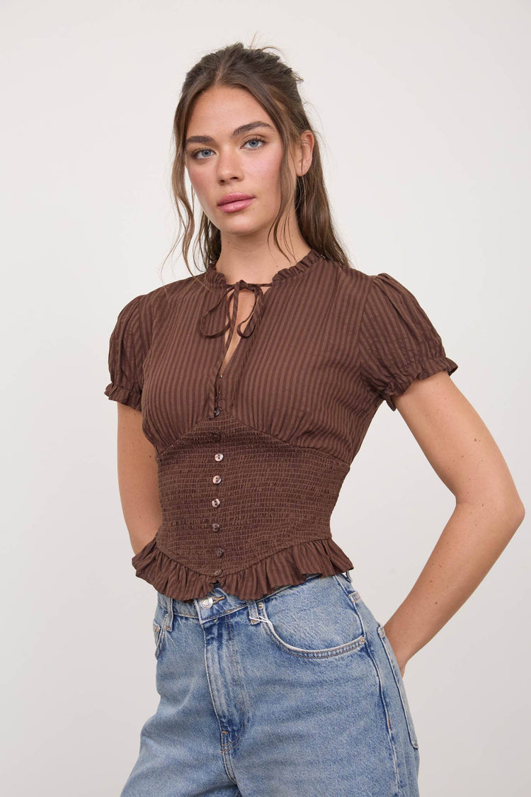 SMOCKED PEPLUM TIE NECK RUFFLED TOP